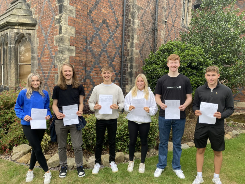 Students celebrate receiving their exam results at Sandbach School today. 