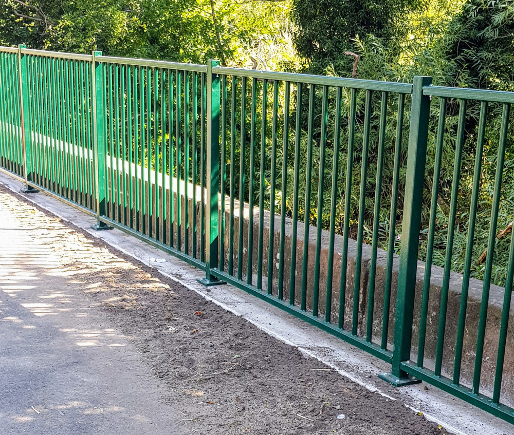 The new metal safety fence constructed by the drop down to Valley Brook (Cllr Brian Silvester).