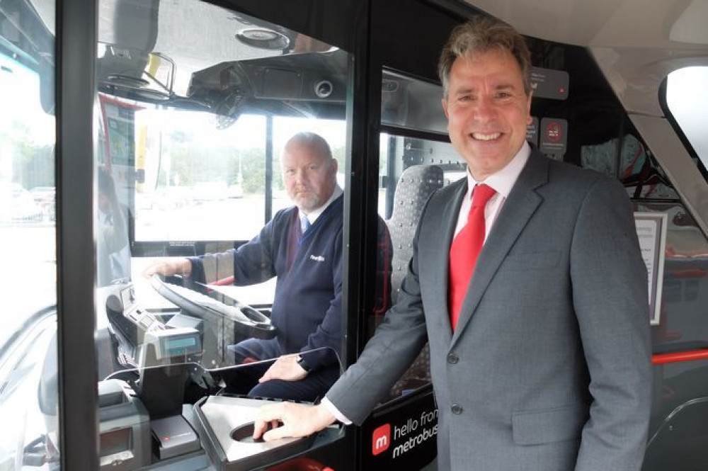 West of England metro mayor Dan Norris on a bus with a driver (Image: West of England Combined Authority, free to use by all partners)