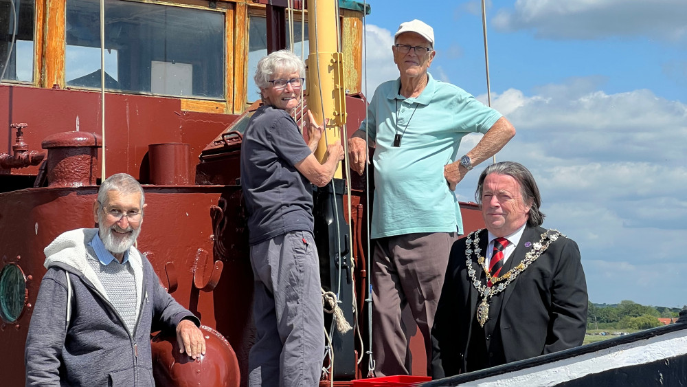 Alec John Hopkins (left) pictured with the owners of the Steam Tug Brent and Maldon Town Mayor Andrew Lay, in June. 