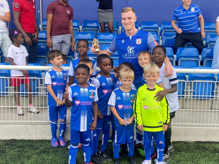 Sam Bantick received his Man of the Match award from Grays youngsters after the game. 