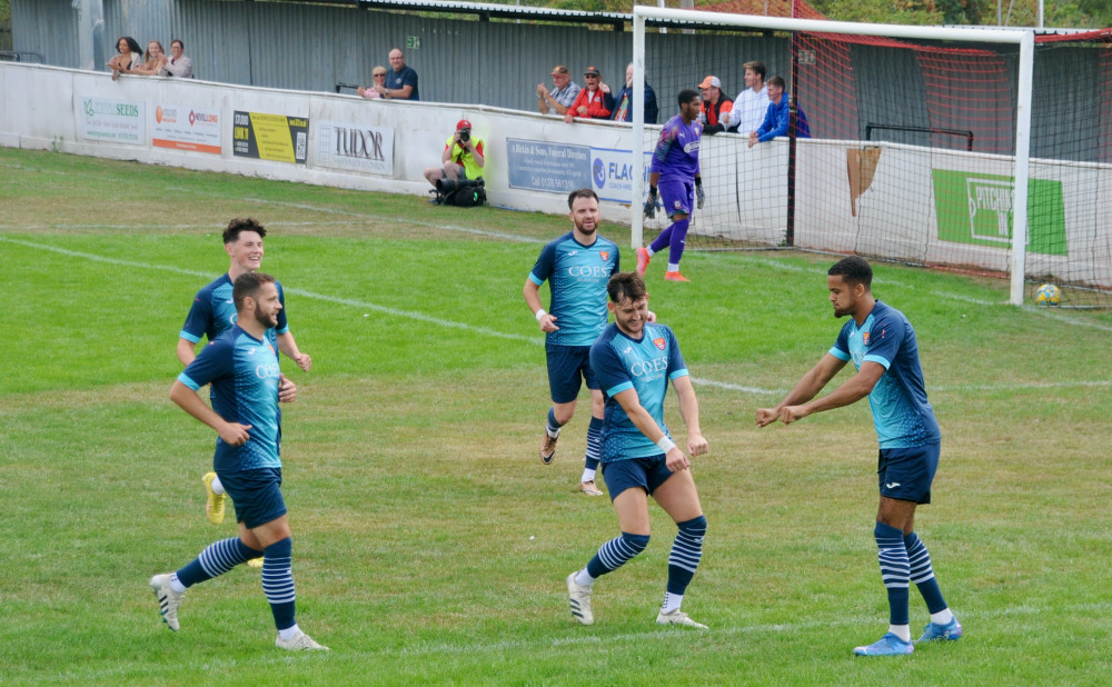 Noel Aitkens, right, celebrates opening goal imitating a lawn mower with Ollie Canfer (Picture credit: Felixstowe Nub News) 