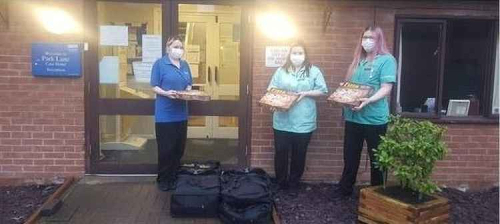 Staff at Park Lane Care Home with their pizzas