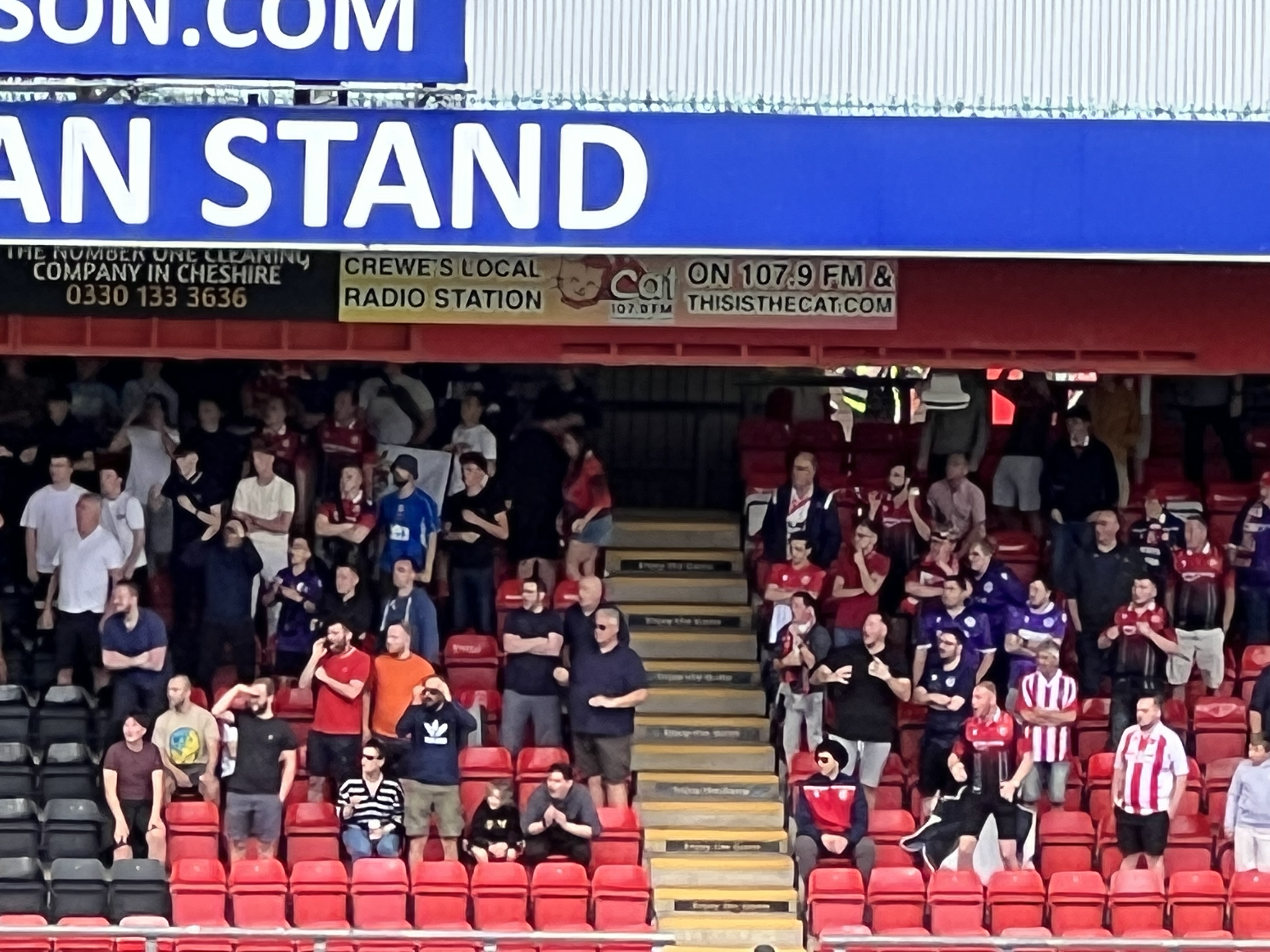 The small but vociferous band of travelling Stevenage fans at Crewe