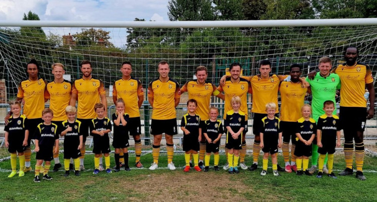 The Rocks team with the match mascots from the youngest group of Future Rocks.