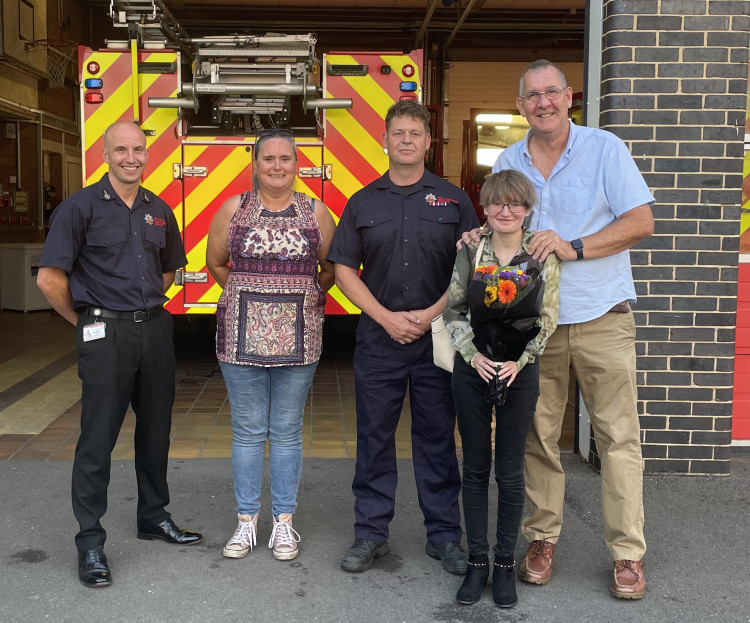 CFO Rick Hylton (left) with Mike and Alison Jones , firefighter Paul Dibble and Amy Jones.