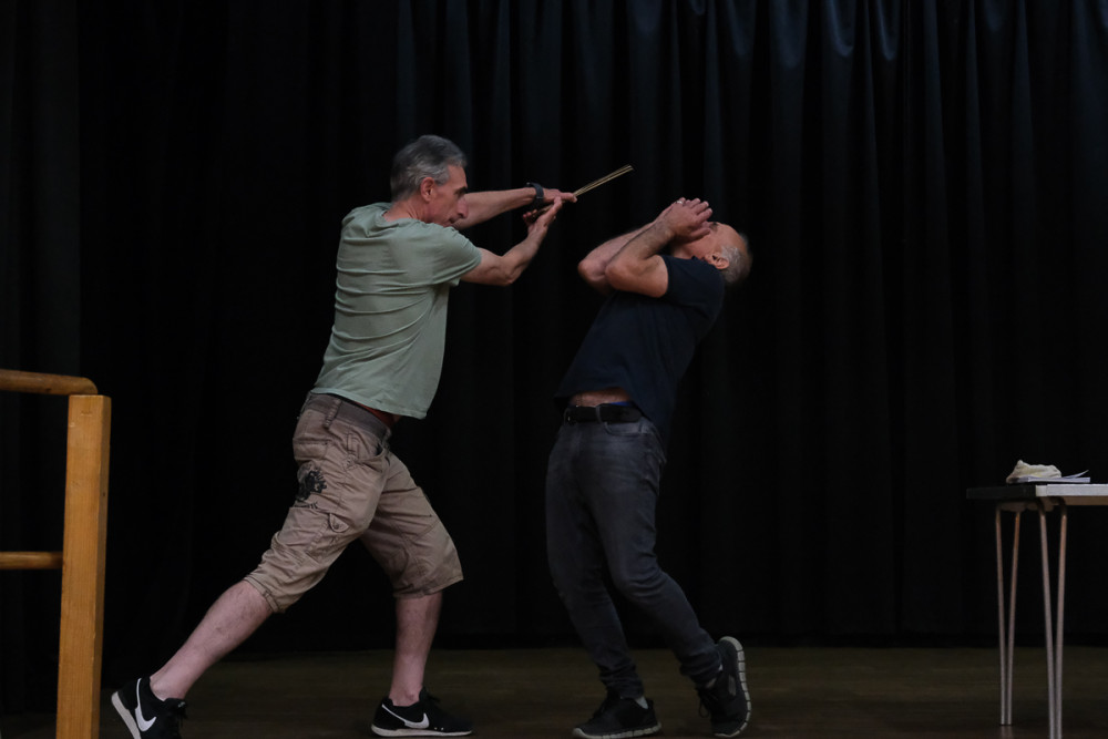 Stage skills: Neil Fisher hits Martin Adams with a cricket bat! Picture by David Weller)