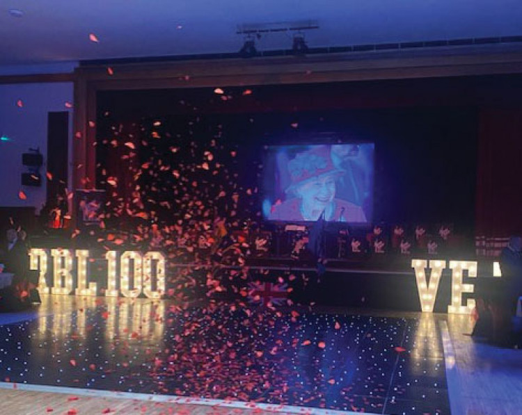 Poppies descended from the ceiling of the Civic Hall as guests and RBL members stood and applauded the life, work and service of Queen Elizabeth II