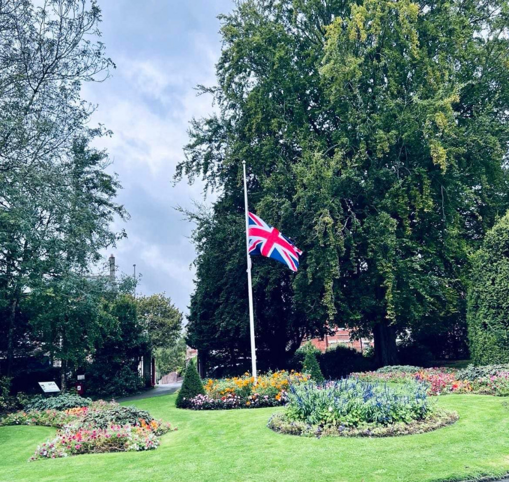 A photo shared by Dorchester Town Council of a flag at half-mast.