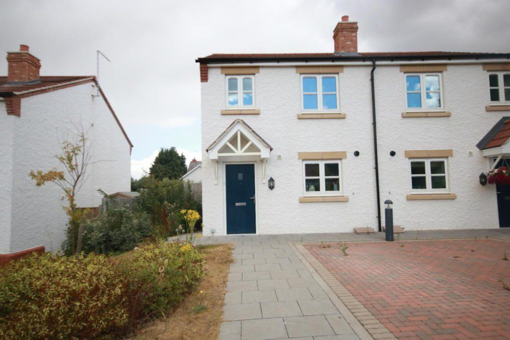 The house has plenty of parking and is situated in a community-minded village (image courtesy of Moores Estate Agents)