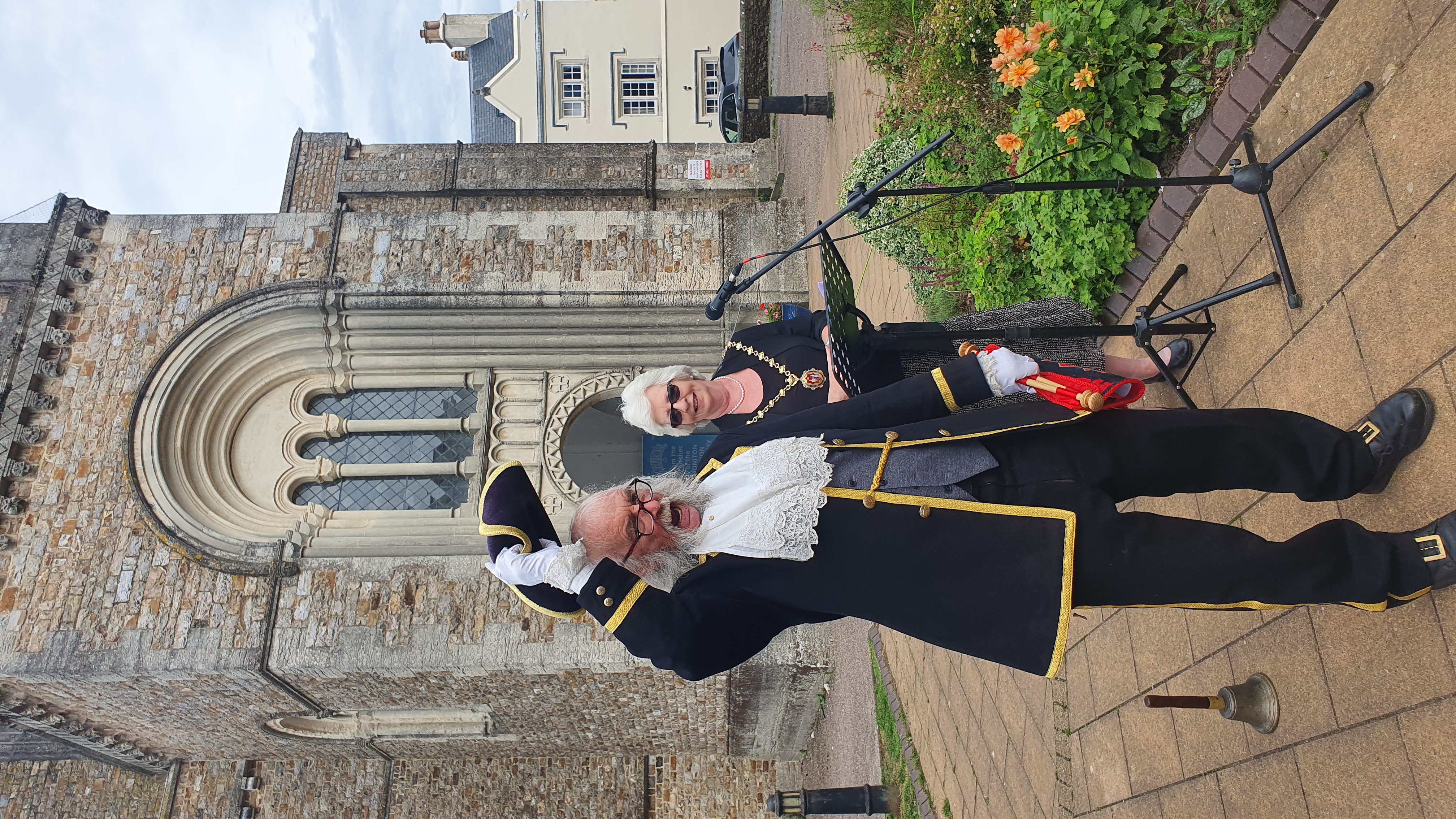 Town Crier Dave Retter leads three chants of 'God Save the King'