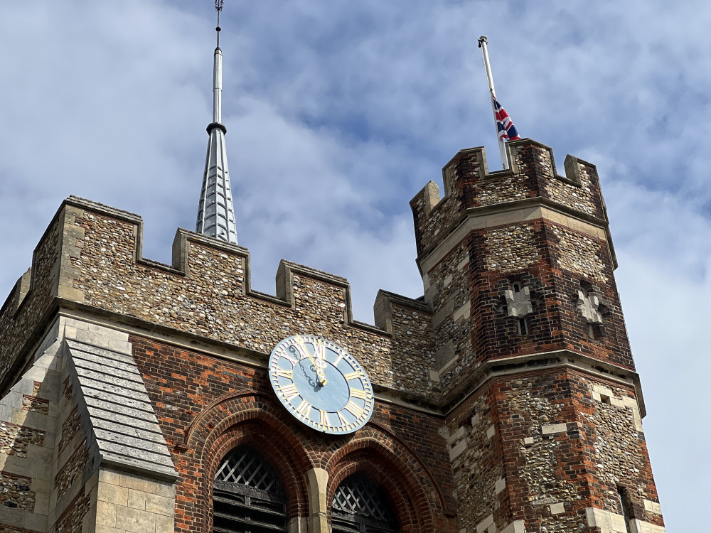 Services for the week ahead at Hitchin's St Mary's Church following the death of Her Majesty, Queen Elizabeth II. PICTURE: The Union flag flies at half mast. CREDIT: @HitchinNubNews 