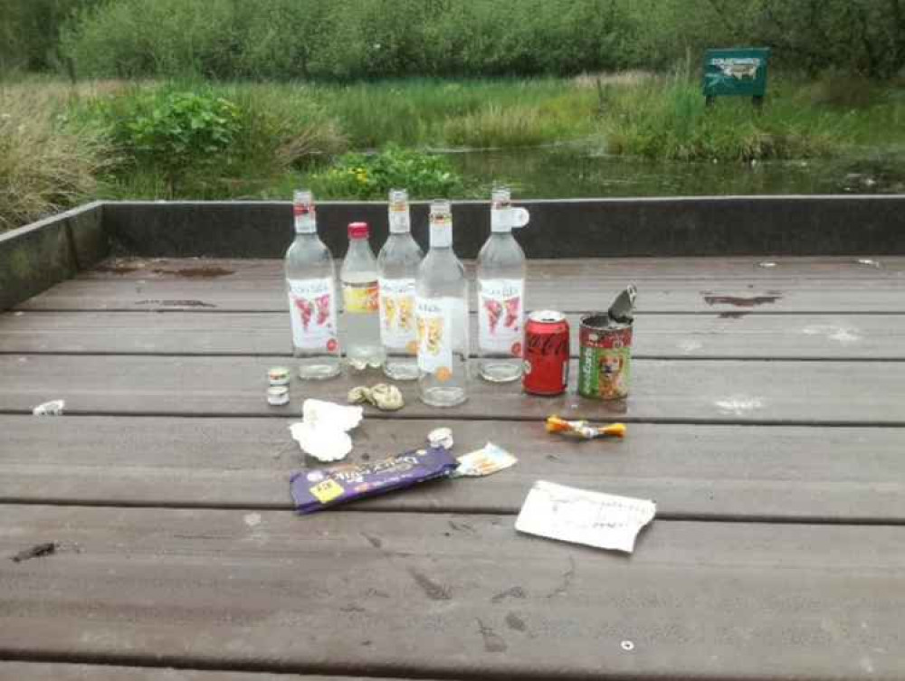 Bottles, cans, and chocolate wrappers were left at the local green space. Image credit: Newpool Meadows