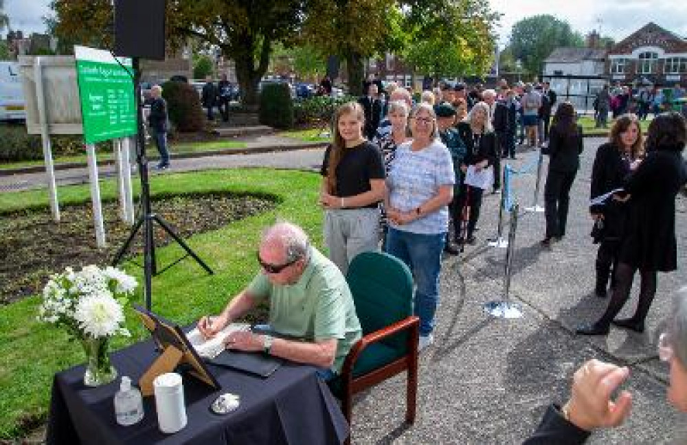 Members of the public attending the Proclamation of King Charles III in Coalville sign the book of condolence for Her Majesty Queen Elizabeth II