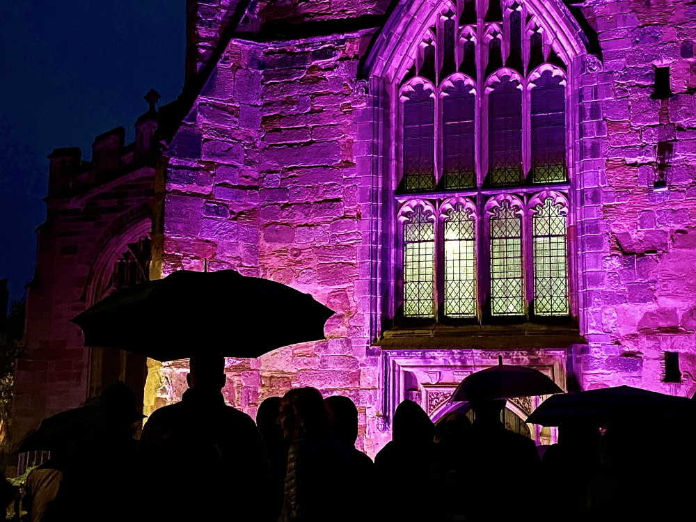 The crowd needed umbrellas and waterproofs for the evening vigil: Photos: Ashby Nub News