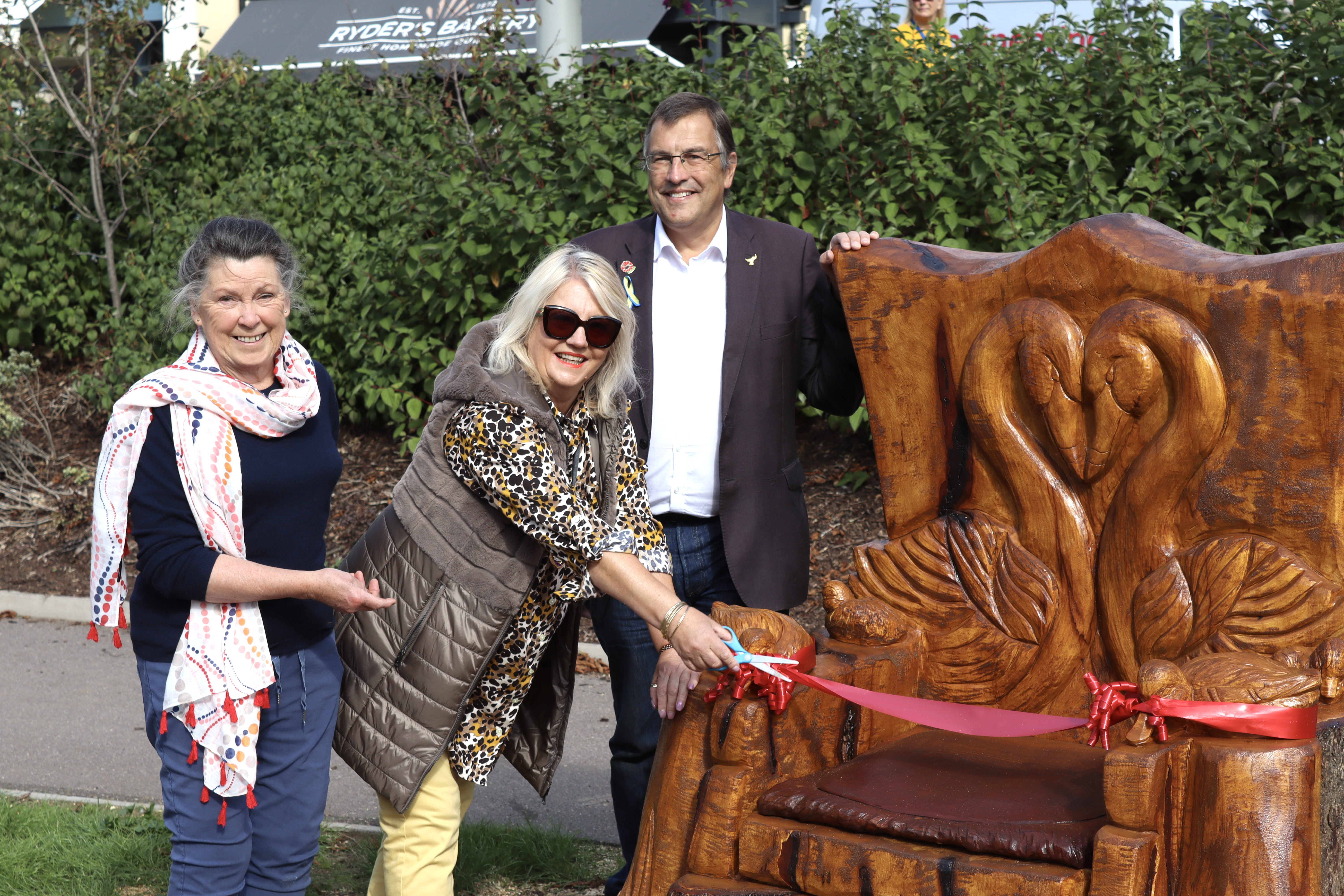 L to R: Cllrs Val Mawhood, Lisa Mayne, and Martin Wrigley with the new throne (Nub News/ Will Goddard)