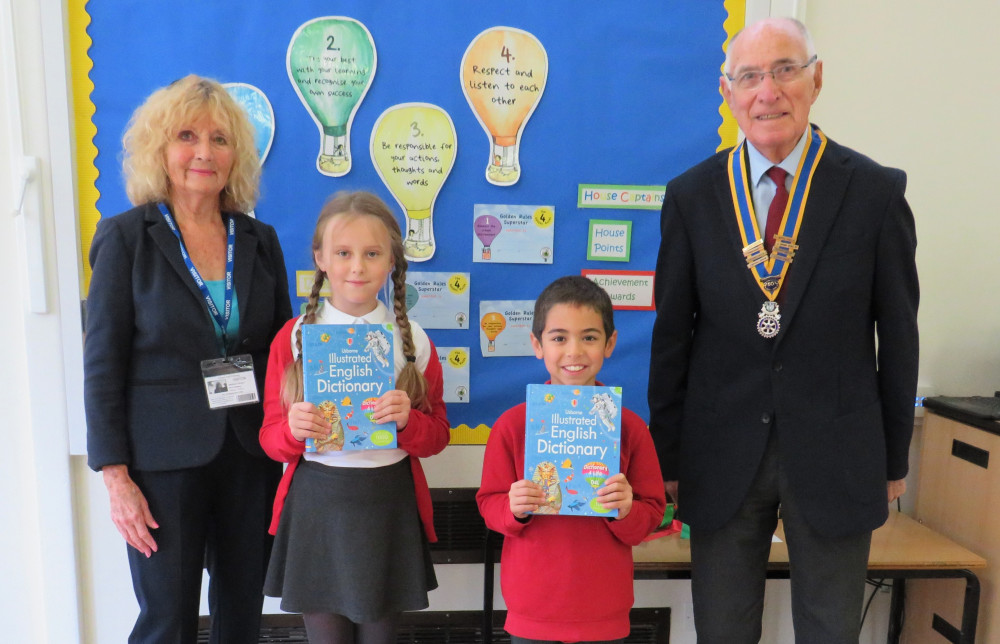 President Peter Talbot photographed with year 4 pupils at Coten End primary school (image supplied)