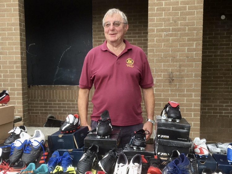 Pete Kuzemka of the Rotary Club helping run the stall.