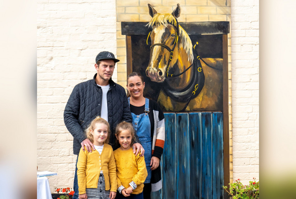 Winners Sennen and Roux Carroll with the new mural at Exmouth Museum (Sheila Haycox)