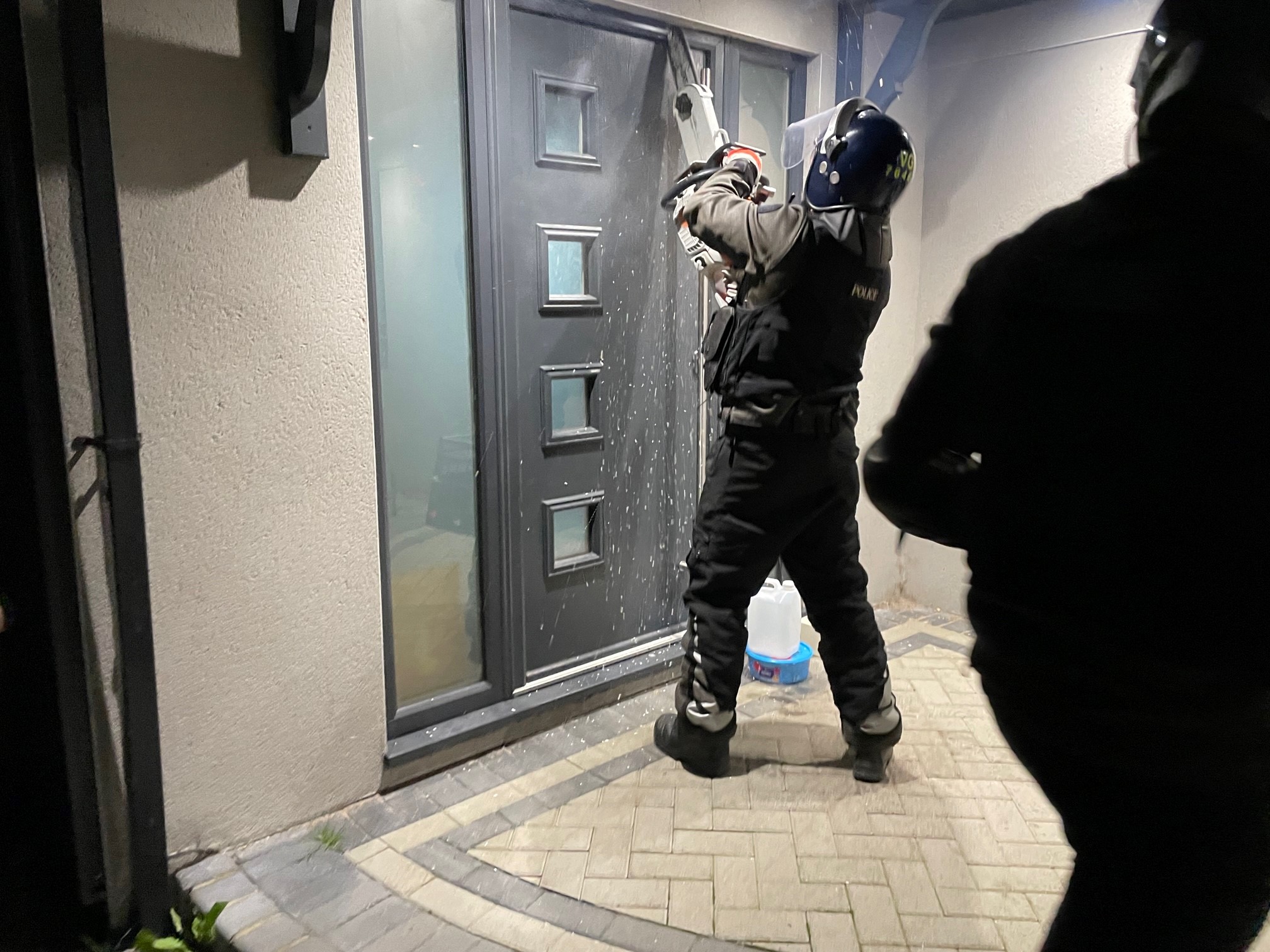 Police break into one of the homes