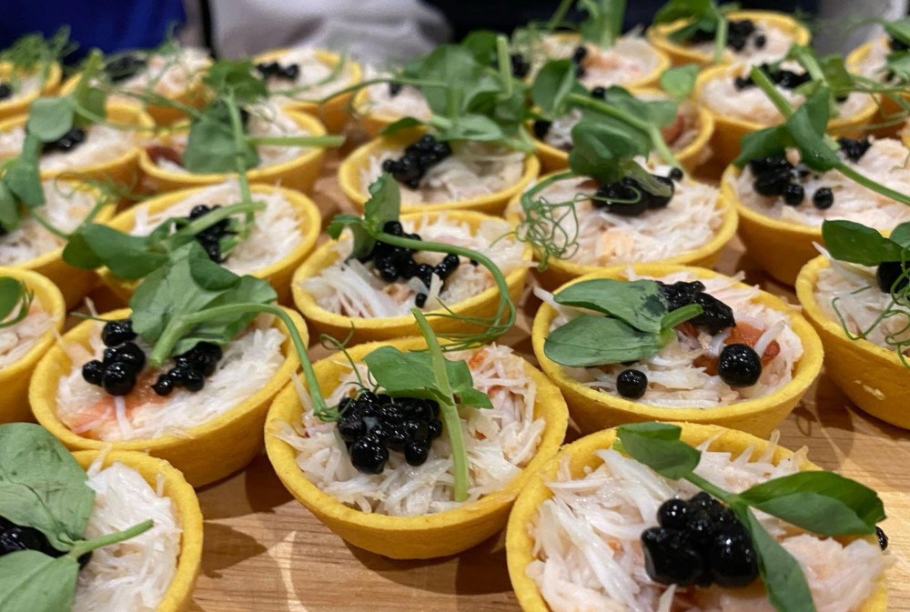 Seaweed caviar pearls on a crab canapé (Ebb Tides)