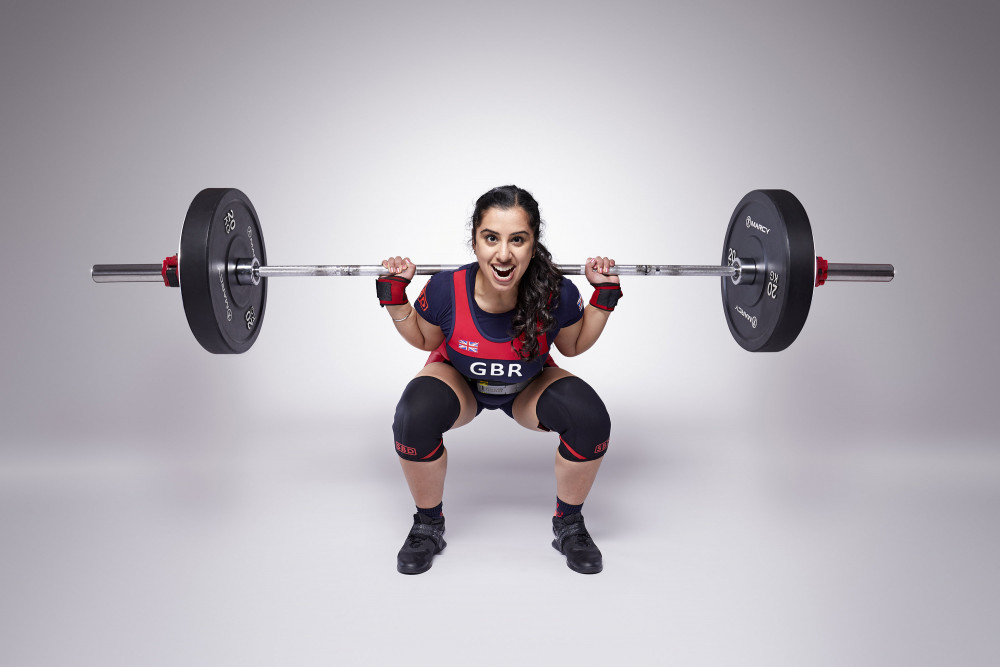 Karenjeet Kaur Bains squatted her own body weight 42 times in one minute to earn the title (image via SWNS)