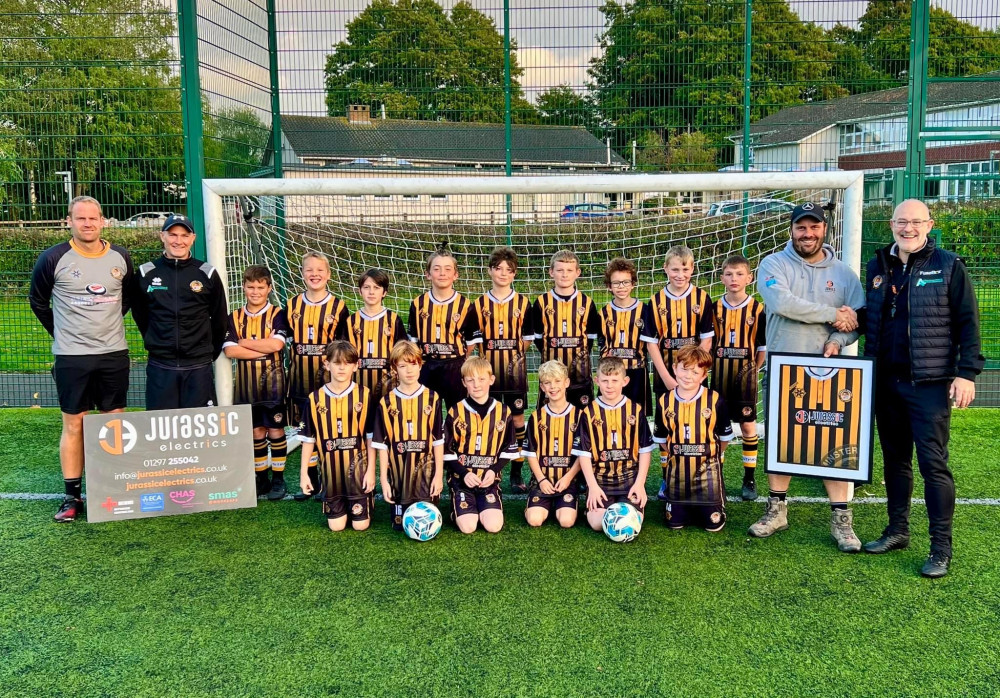 Axminster Town Under 11s in their new strip courtesy of Jurassic Electrics