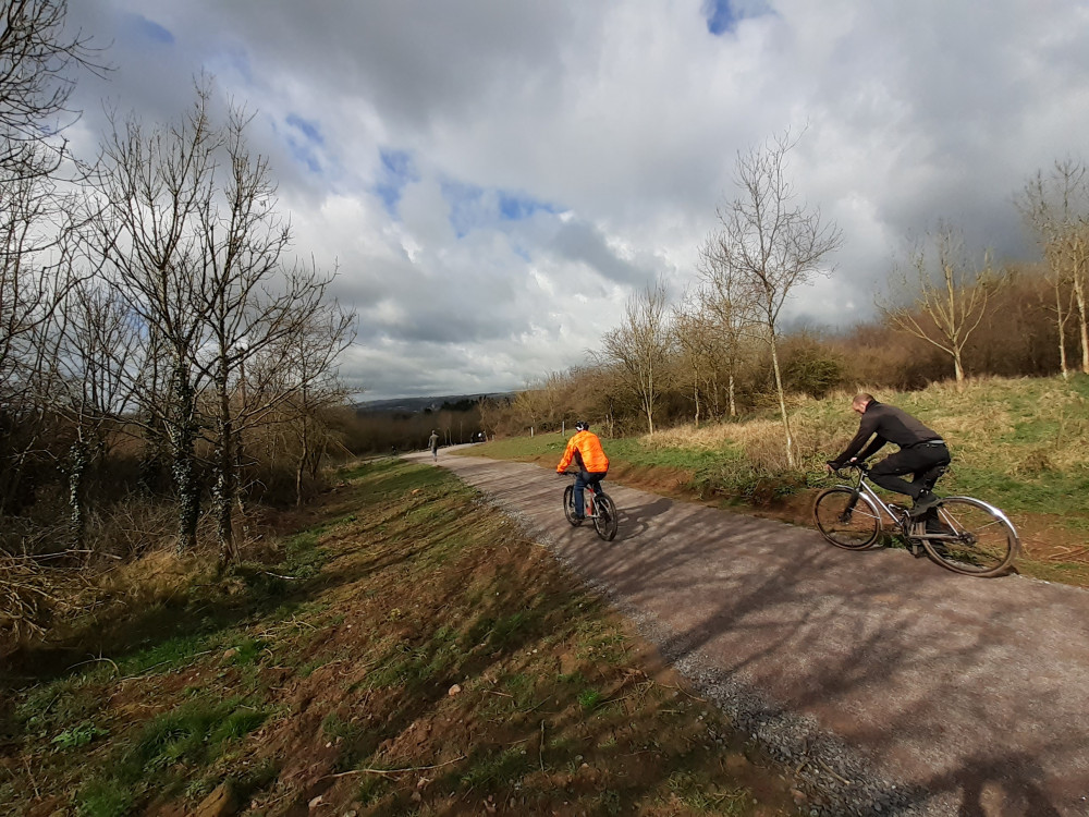 Cyclists using a multi-user path in Dulcote Cyclists using a multi-user path in Dulcote