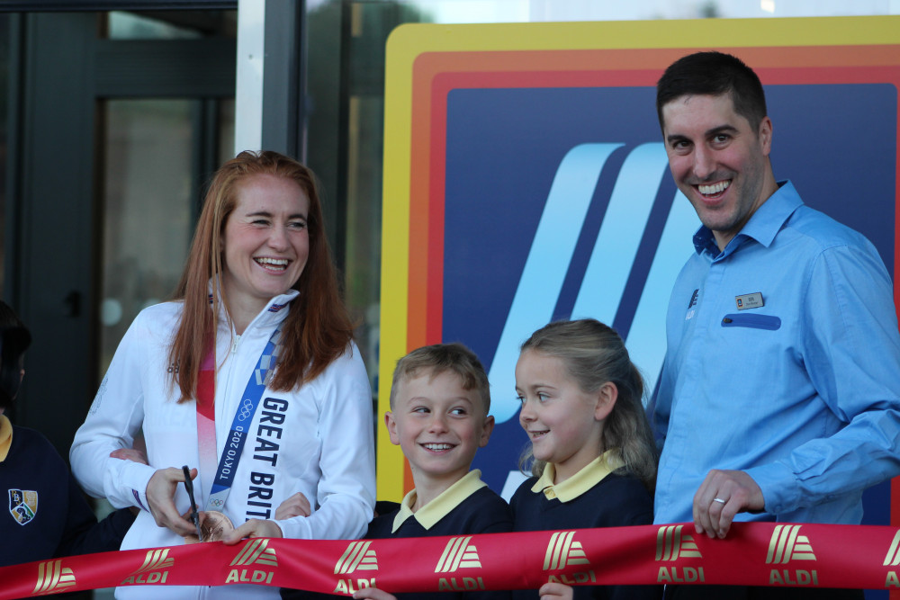 Olympic bronze medal winner Sarah Jones with pupils of Puss Bank School and new store manager Ben Lomas of the Macclesfield Silk Road Store. (Image - Alexander Greensmith / Macclesfield Nub News)