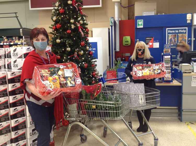 Home Instead collect Christmas hampers from a local supermarket