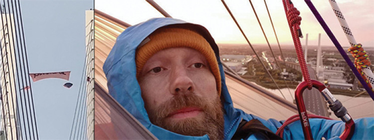 After unfurling a banner the campaigners snuggled into their hammocks for a night's sleep. 