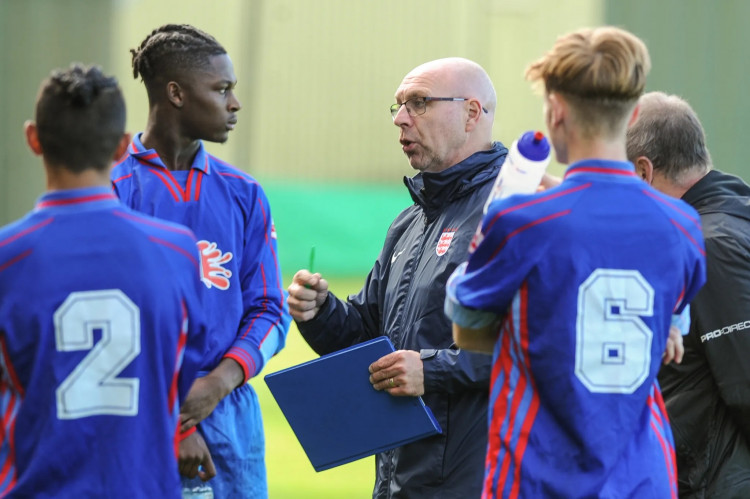 Oliver Hart (blue 6) listening to coaching during England trial