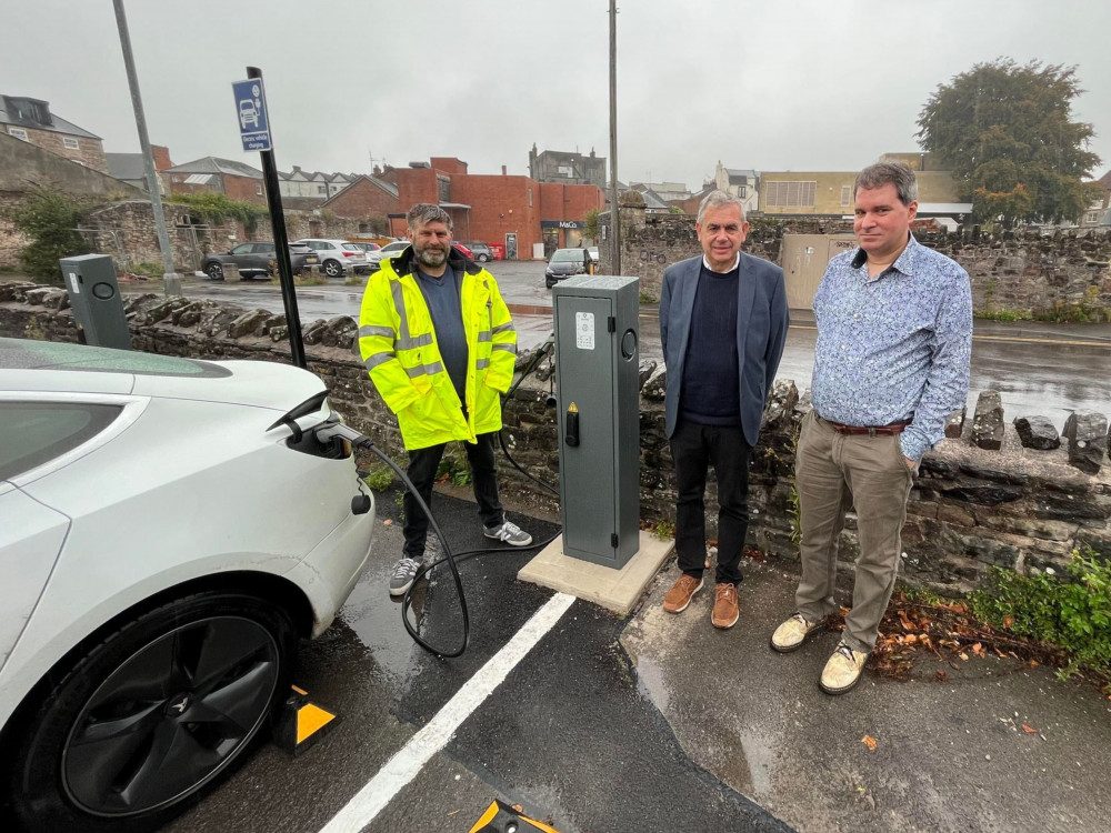 (L-R): Morgan Hands, Project Manager (EB Charging), Cllr Simon Carswell, Portfolio Holder for Neighbourhood Services (MDC), Gavin Fear, Contracts and Asset Maintenance Manager (MDC) photographed by one of the new EVCPs in South Street Car Park, Wells.