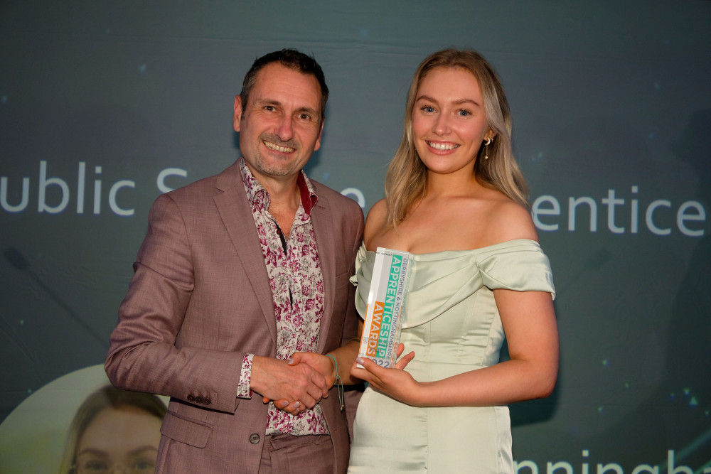 A Hucknall opticians is celebrating after a member of the team was one of the winners at the 2022 Derbyshire and Nottinghamshire Apprenticeship Awards. Pictured: Erin presented with her award by Phil Bramley. Photo Credit: Dean Atkins Photography.