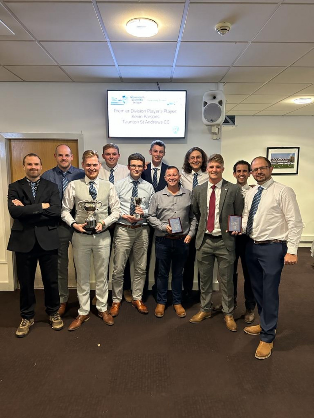 The beaming members of Frome Cricket Club : Richard Potter and players of the 2nd XI with Tom Abell and the Division 1 title cup and Ladbroke Merit Trophy.