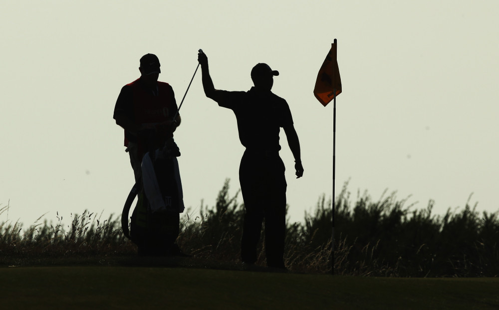 The unmistakable silhouette of Tiger Woods at Hoylake in 2014