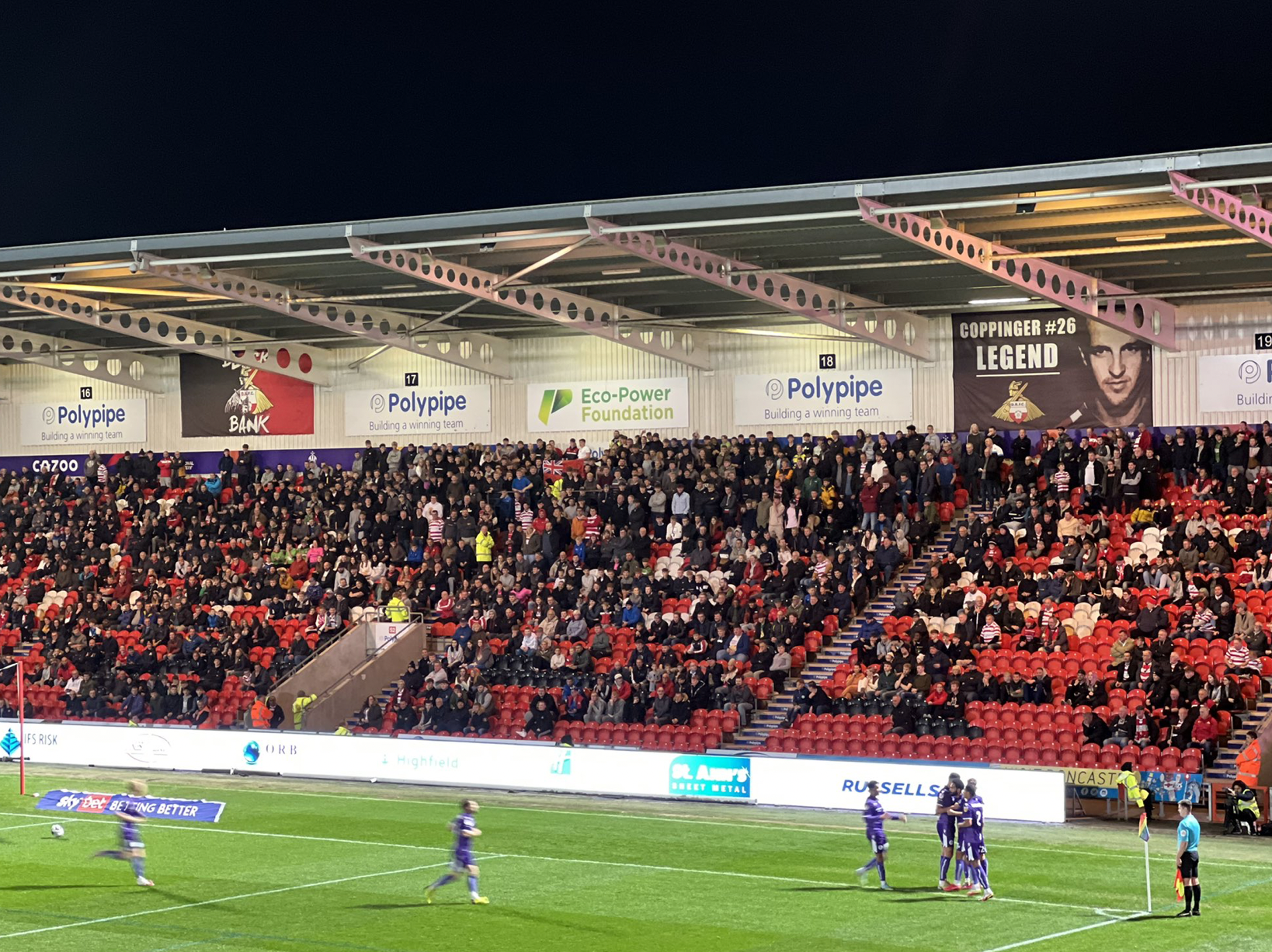 Stevenage celebrate Jordan Roberts goal at Doncaster. CREDIT: @laythy29