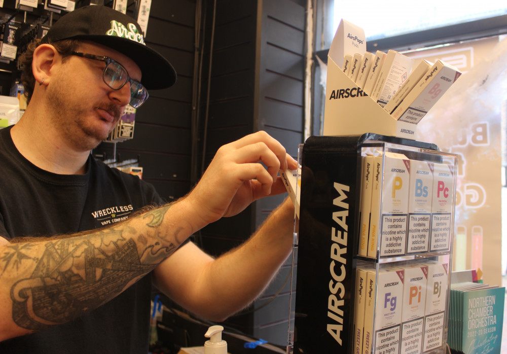 Sam Streets is one of two employees at Macclesfield's Wreckless Vape Company. Here he is pictured with the new Airscream product. (Image - Alexander Greensmith / Macclesfield Nub News)