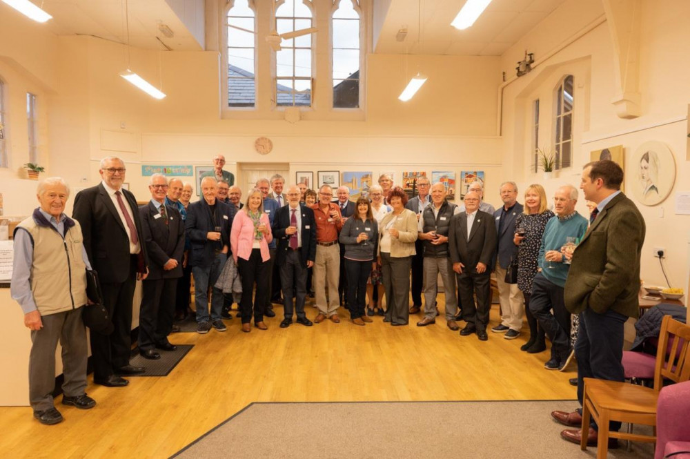  Harbury e-Wheels, receive their Queen’s Award for Voluntary Service from Tim Cox, His Majesty’s Lord Lieutenant of Warwickshire (Image via Warwickshire County Council)