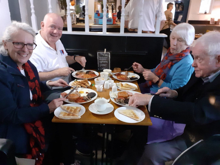 Branch secretary, Linda Williams (front left) enjoys breakfast at Saturday's event. 