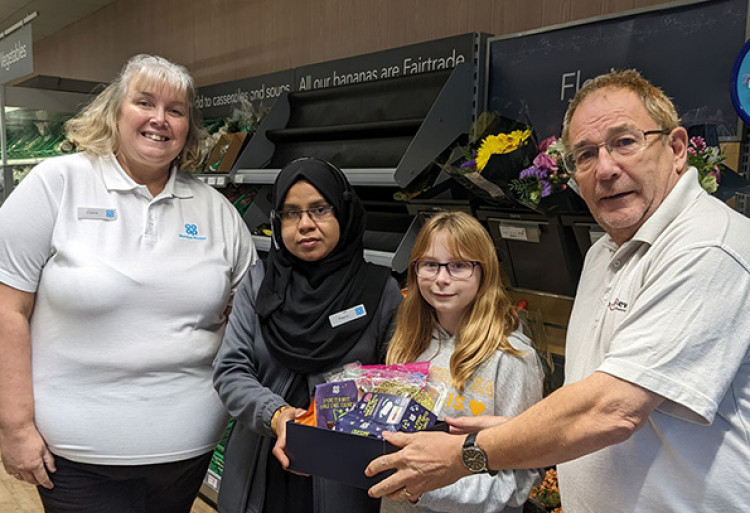 Happy Halloween. Sophie Firth collects a prize at the Socketts Heath Co-op. 