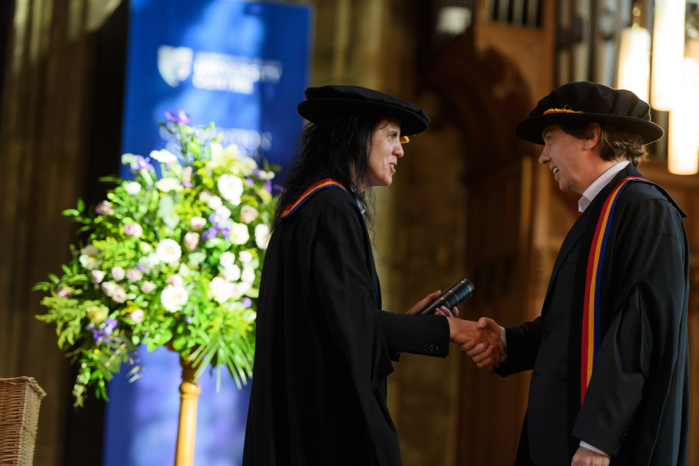 David Darling, CEO of Kwalee receiving the Fellowship Award from Angela Joyce, CEO of WCUC (image supplied)