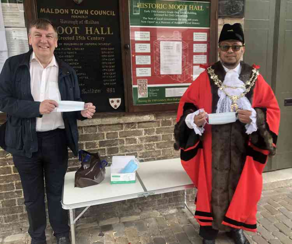 Maldon MP John Whittingdale and Mayor Councillor Abdul Hafiz (known as Jhual) hand out face masks to town centre shoppers