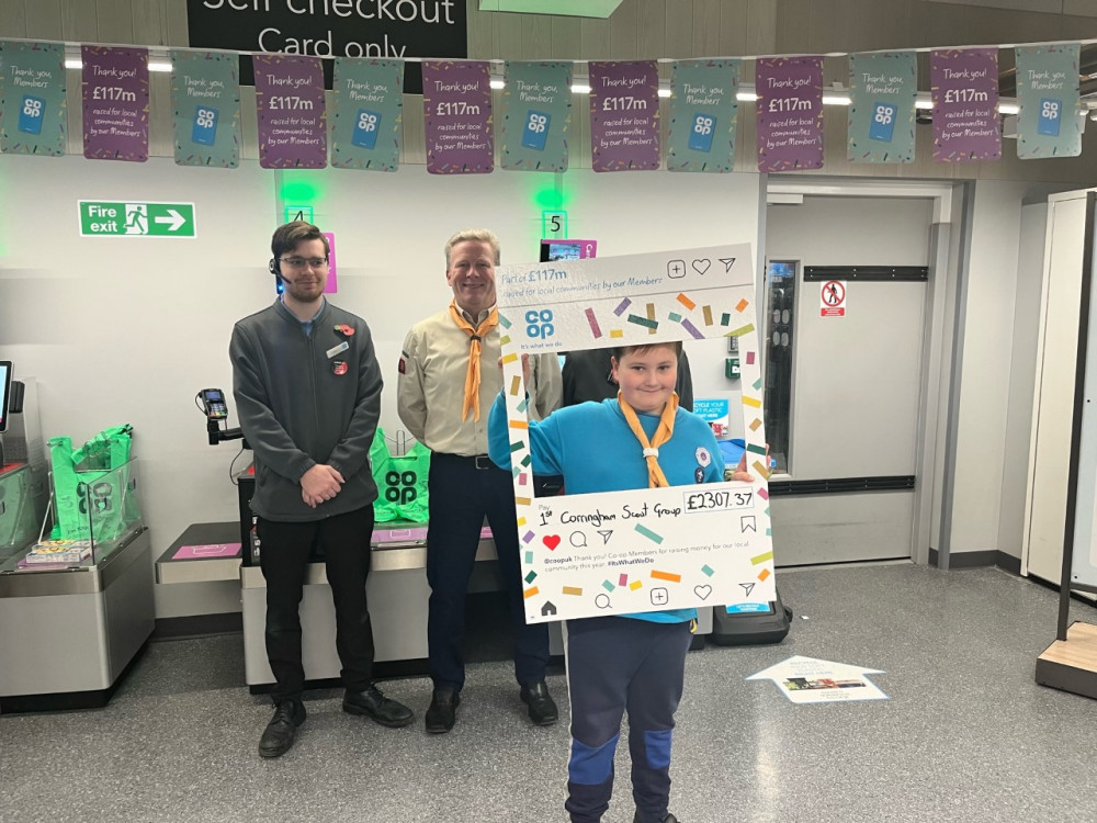 1st Corringham Scouts cheque in.