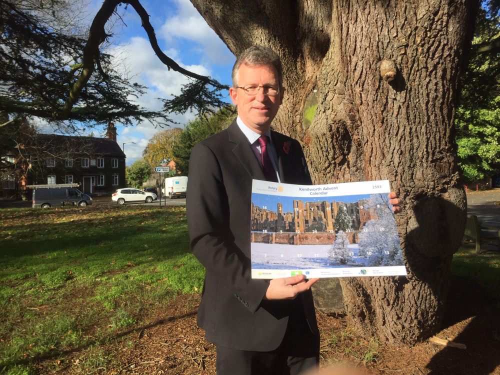 Sir Jeremy Wright pictured with his copy of the Kenilworth Advent Calendar outside Jubilee House (image supplied)