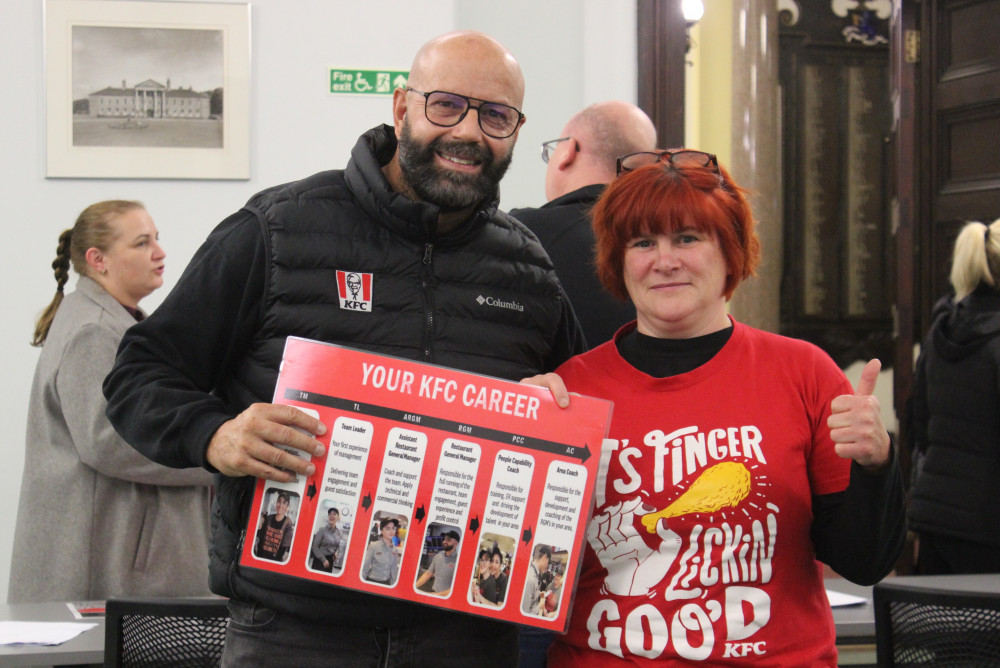 KFC Area Coach Simon Thompson with new KFC Macclesfield Manager Sarah Wheeler, pictured inside Macclesfield Town Hall. (Image - Alexander Greensmith / Macclesfield Nub News)