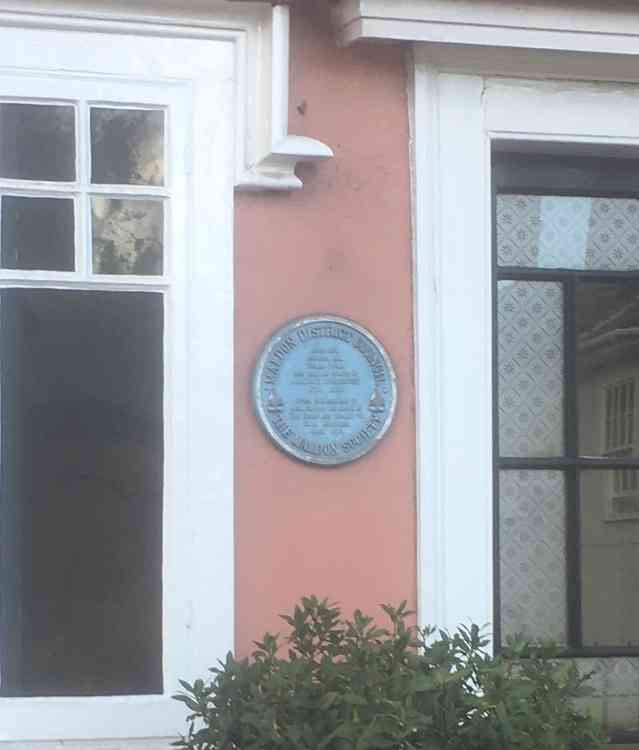 The blue plaque on the site of the old workhouse on Market Hill