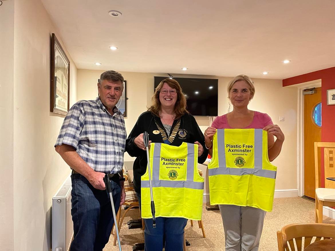 Beverley Love of Axminster & District Lions Club (centre) with Peter Hales and Sarah Birnie of Plastic Free Axminster (photo credit: Julie Burke )