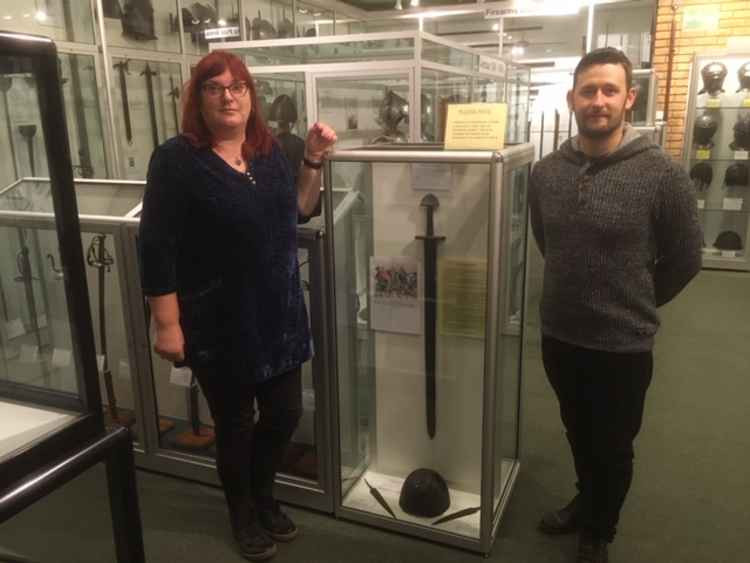 Julie Miller and Kyle Monk with the Viking sword