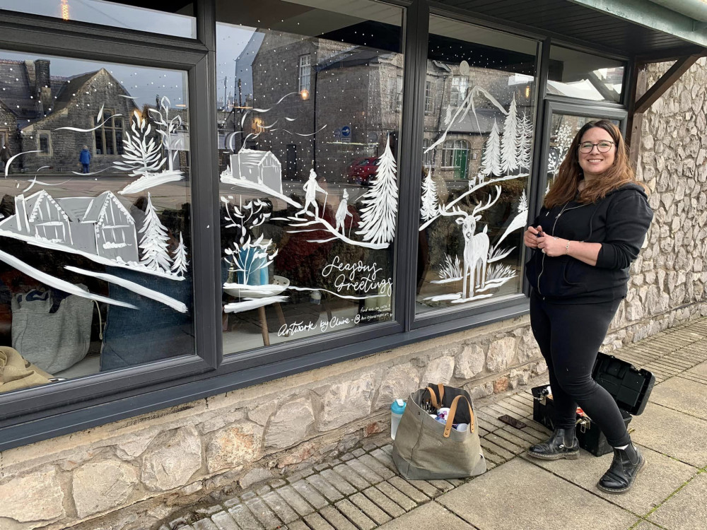 Claire Danvers, who is Huxley and Mabel Art, paints festive window of 96 Degrees Coffee 